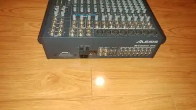 The Alesis Studio 24 is a compact 8-bus analog recording console featuring an inline monitoring syst...