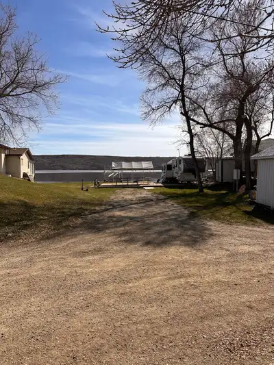 - Lot & a half - 60’x100’ - Wideopen with power panel to plug in three campers & 110V plugs - buried...