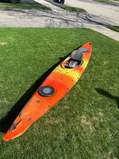 New Wilderness Systems Tsunami 140,ruder system,lots of storage,never in water,$1900 -purchased in20...