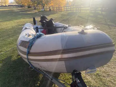 12’ Aluminum hulled Zodiac Cadet (RHIB) 2020 with 20 hp Tohatsu 4 stroke outboard 2021, and Karavan...