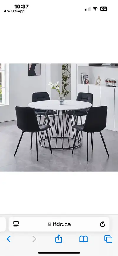 Selling a round dining table with a faux marble top and stylish black metal base. It comes with four...