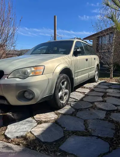 This is a 2005 Subaru Outback wagon with a fuel-efficient engine and all-wheel drive, perfect for na...