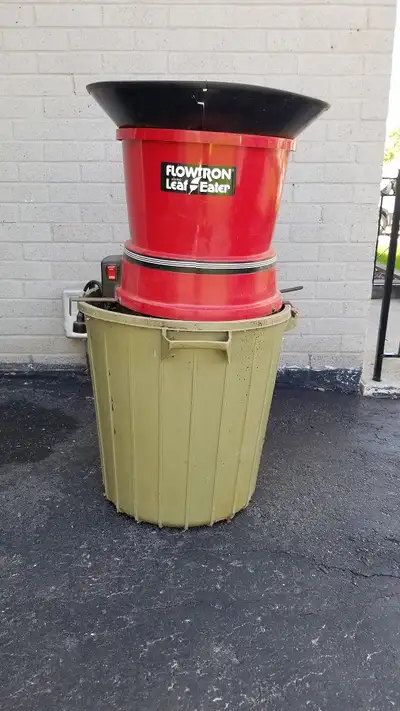 Flowtron Electric Leaf Mulcher shreds leaves into a garbage can (included). Extra Leaf-Eater replace...