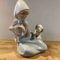 Figurine fille jouant avec son chat et chien de Lladro 