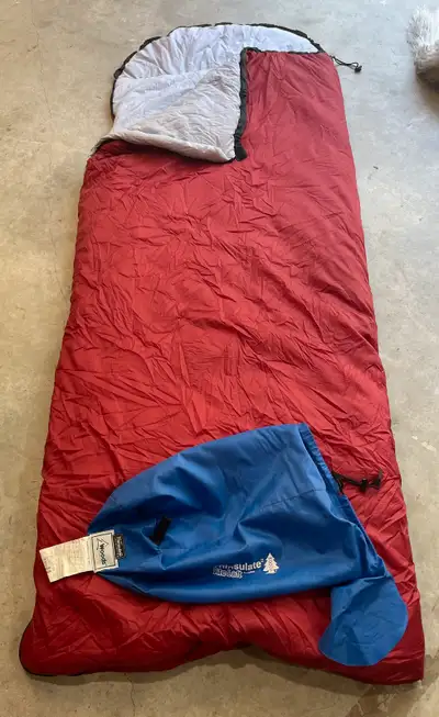 Snuggle up in these like-new Woods Canada Thinsulate adult sleeping bags, perfect for camping or sle...
