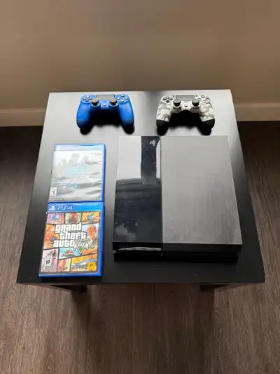 Includes: • PS4 console • 2 controllers (blue & camo) • GTA V • Need for Speed Everything works perf...