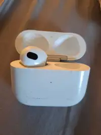 Left airpod and charging case 