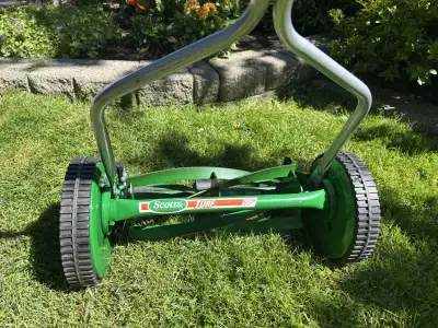 Scotts manual push lawn mower with a cutting width of 14 -inches.
