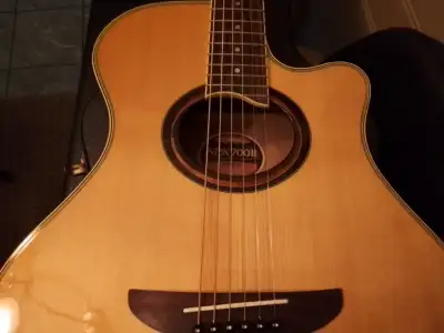 Yamaha thinline cutaway acoustic/electric guitar in exceptional condition (looks new). New strings,...