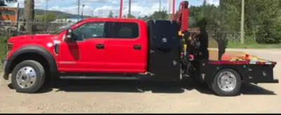 2018 Ford F-550, with full width tool cabinets, Ferrari 551 picker with radio remote control.