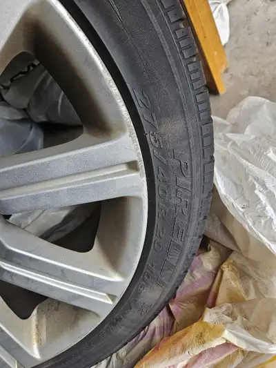 I'm selling 4, used Land Rover tires & rims size 275/40R20 106V M+S. The tire is mounted on a silver...
