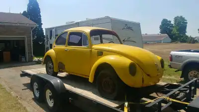 1972 Super Beetle, rolling, shell, no engine but trans axle is there. Rusty inside, but floor pans m...