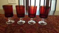 Four Dark Red Glass Pedestal Goblets
