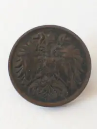 Old button made from 1911 Austria 2 heller coin