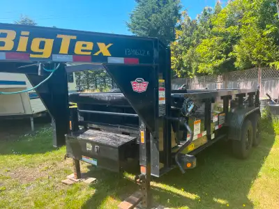 This Gooseneck Big Tex hydraulic dump trailer comes with ramps and a new spare tire.
