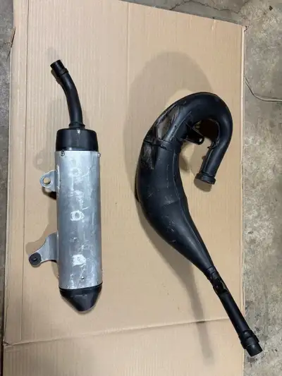 2022 Yamaha yz125x silencer muffler, exhaust pipe, both $150. Used, some dents, please see pictures.