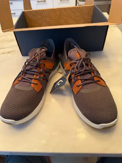 I am selling these Brand New / Never Worn OLUKAI men’s sneakers. Color is Pavement/Vintage Indigo. T...
