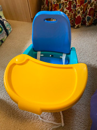 Infant booster seat for a chair
