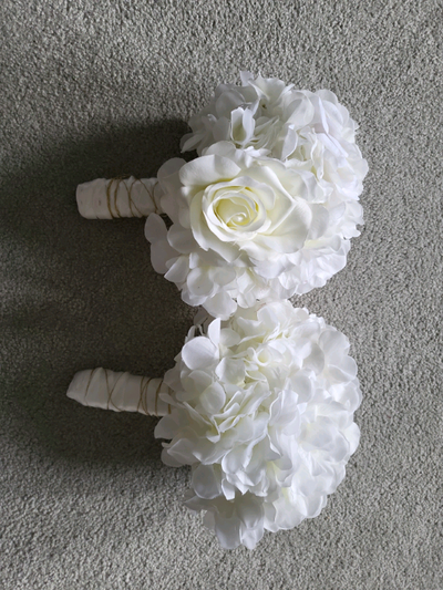 Two hand crafted bouquets made with artificial flowers , View more