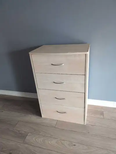 This is a used 4-drawer dresser, perfect for adding storage space to any room. It's in good conditio...