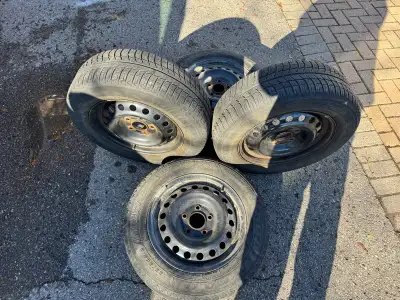 Four 15" steel rims currently with 195/65R15 tires on them. Two winter tires are good for another se...