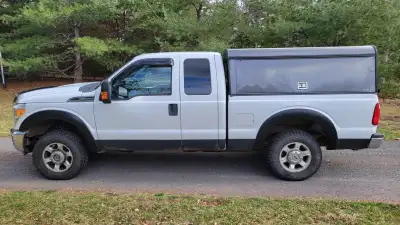 2014 Ford F250 4x4 with ARE cap and bedslide