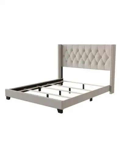 This bed frame features a tufted upholstered headboard with nailhead trim. It's made with a sturdy w...