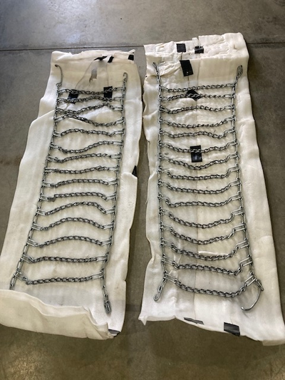 One set of tire chains from an LA 135 John Deere Utility tractor. Wheel size 20x10.00x 8 tires. Has...