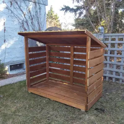 Firewood storage shelter made by Forest Trek Woodwork Firewood shelter comes in cedar or pressure tr...