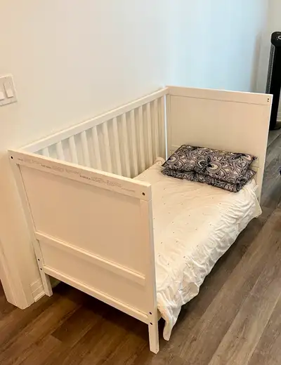 Crib in brand new mint condition. Adjustable mattress height. Mattress if required included in price...