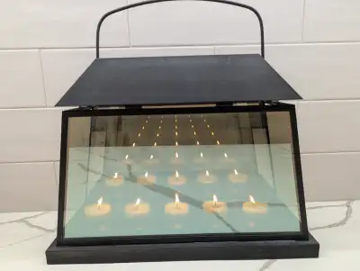 Excellent quality Metal framed lantern with reflective glass panels create the illusion of more than...