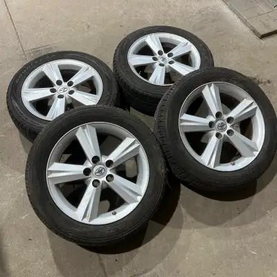 Set of four OEM Toyota aluminum alloy wheels with 215/55/17 Goodyear All season tires mounted. Tires...