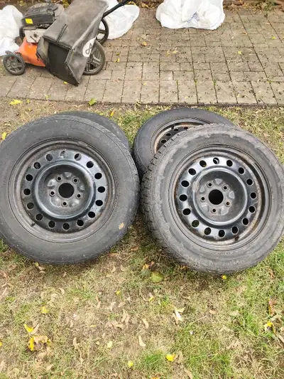 Set of 225/60R17 Hercules Avalanche tires mounted on steel rims. These are pre-owned tires that show...