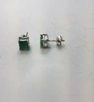 Description: Elegant vintage stud earrings featuring vivid green square cut gemstones set in a refin...
