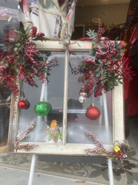 Christmas decorated vintagn windows with battery operated lights