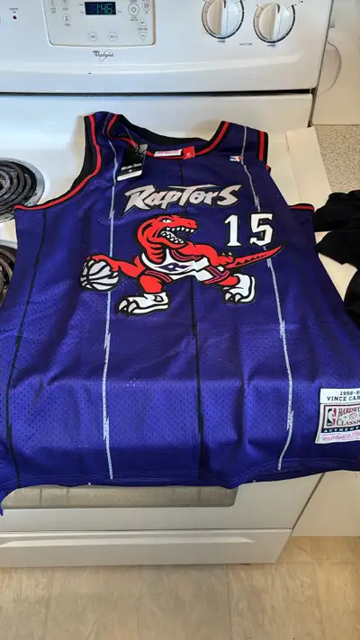 New never worn retro Toronto Raptors Vince Carter Jersey Made by Mitchell & Ness Still has tags on i...