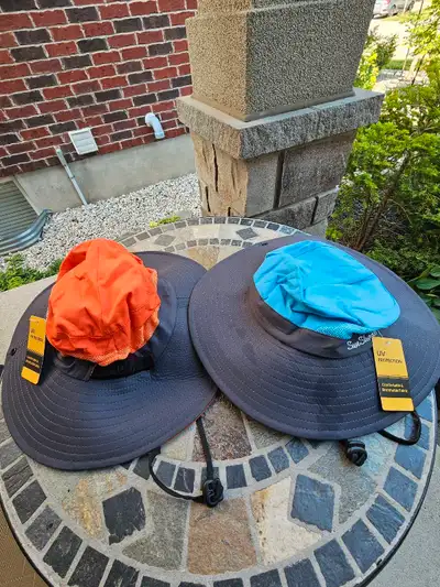 2 Sun Shade Hats for adults. UV protection. Chin straps and side snaps. New and never worn. Price is...