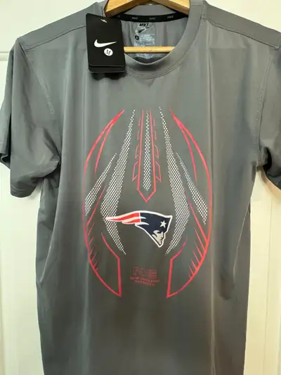 Brand New with tags NIKE Compression Shirt with New England Patriots logo. Size M, fits tight!