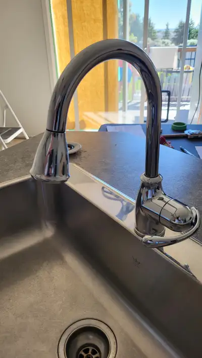 Moen kitchen faucet with pulldown spray function. Stands 13" tall from base and includes all mountin...