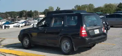 A 2003 Subaru Forester XS for sale. 5 speed manual, sunroof, 312K kilometers. Strong engine, tranny...