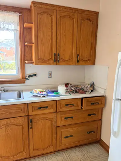 Oak Kitchen Cabinets in good condition. $650 Stove $99