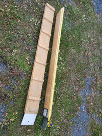 Pair of 2" thick wooden loading ramps with cleats.