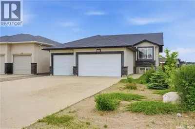 Well kept Pilot Butte bi-level with triple garage. 1121 square foot, 3 bedroom, 2 bath family home w...