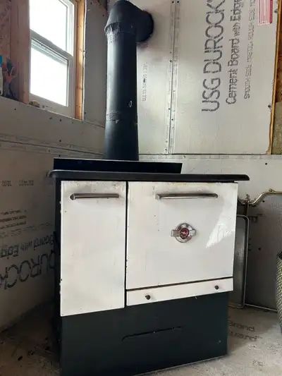 Selling a classic vintage wood-burning cook stove in solid condition. Great piece for a cabin, garag...