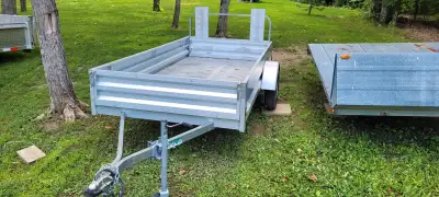 Lightly Used Utility Trailer. Hitch accepts 2" ball. All lights work. Tires like new. Adjustable ram...