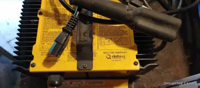 This is a used Delta-Q Yamaha 48V 18A battery charger, perfect for keeping your batteries in top con...