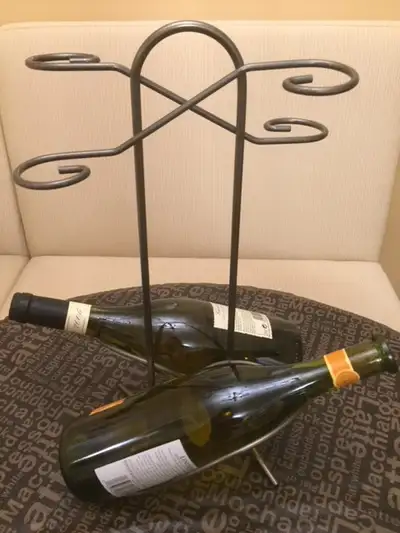 Like new condition, never been used. Metal wine rack holds two bottles and four wine glasses for sto...