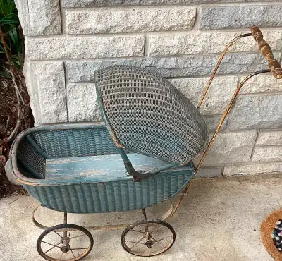 This vintage doll stroller is ready for a new home. Perfect to display collectibles in. Wicker with...