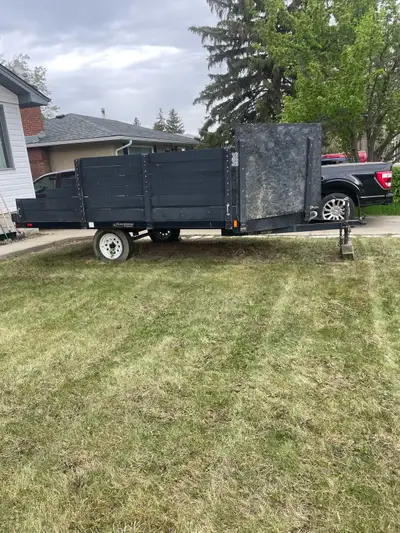 This is a used snowmobile/quad trailer, perfect for hauling your toys! Its sturdy build ensures reli...