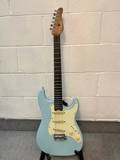 Schecter Nick Johnston SSS Stratocaster made in Indonesia. It plays and sounds great. There are a co...